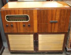 A walnut cased Raymond radiogram