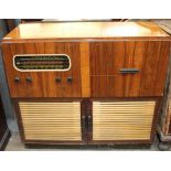 A walnut cased Raymond radiogram