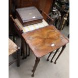 A 20th century walnut nest of tables together with a piano stool, a laptop desk,