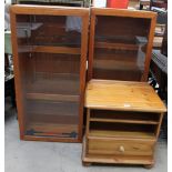A pair of teak hanging wall cabinets together with a pine bedside cabinet