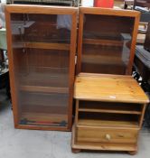 A pair of teak hanging wall cabinets together with a pine bedside cabinet