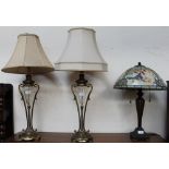 A pair of brass and glass table lamps in the form of vases,