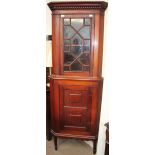 An Edwardian mahogany standing corner cupboard,