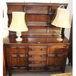 A 20th century Dutch oak dresser and two table lamps