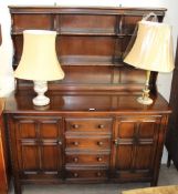 A 20th century Dutch oak dresser and two table lamps