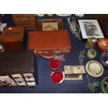 An oak and silver mounted cigar box together with a miniature chest of drawers, a leather case,