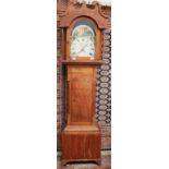 A pine longcase clock, with a broken swan neck pediment, long trunk door, box base and bracket feet,