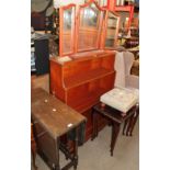 A 20th century oak gateleg dining table together with a dressing table mirror, waterfall bookcase,
