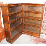 A Globe Wernicke mahogany eight section corner bookcase with glass up and over doors