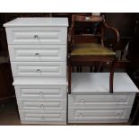 A modern chest of drawers together with a pair of wooden chests and a reproduction mahogany elbow
