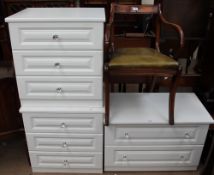 A modern chest of drawers together with a pair of wooden chests and a reproduction mahogany elbow