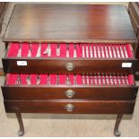 A community plate part flatware service contained within three drawers