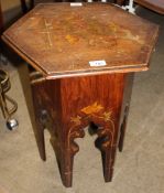 A floral decorated hexagonal occasional table