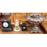 A black slate mantle clock together with an anniversary clock, a copper samovar,