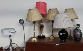 A set of three glass and brass table lamps together with other table and desk lamps