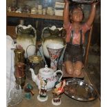 A plaster figure of a small boy together with pottery vases, miners lamps,