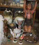 A plaster figure of a small boy together with pottery vases, miners lamps,