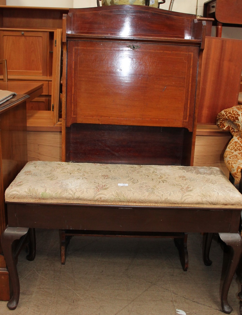 An Edwardian mahogany bureau with a drop flap, encasing pigeon holes,