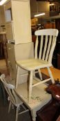 A cream and floral painted side table together with two pot cupboards and two painted kitchen