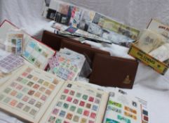 A stamp album containing a Penny Black, Penny reds etc together with stock books,