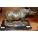 Milo A bronze model of a rhinoceros on a bronze or marble base