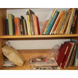 A collection of books including Children's annuals, cookery, needlework, together with postcards,