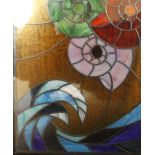 A stained glass window panel encased in glass sheets
