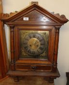 An Edwardian walnut wall clock,