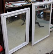 Two white painted wall mirrors