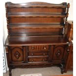 A 20th century oak dresser, the rack with two shelves,