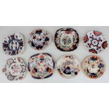 A collection of Gaudy Welsh bread and butter plates, various patterns including grapes, hexagon,