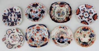 A collection of Gaudy Welsh bread and butter plates, various patterns including grapes, hexagon,