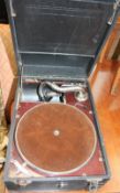 A leatherette covered table top gramophone and records