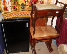 A piano stool together with a teak nest of three tables and two television monitors