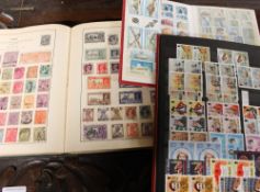 Seven assorted stamp albums containing world stamps and a loose stamp album