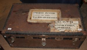 A trunk containing a croquet set together with a camp stove etc