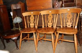 A set of three modern kitchen chairs together with two bookcases,