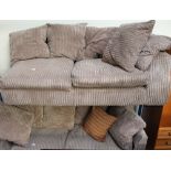 A grey upholstered corner suite