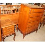 A walnut continental headboard together with a five drawer chest on cabriole legs and turned feet