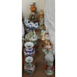 A collection of Beswick Beatrix Potter figures together with a blue and white pottery cow creamer,