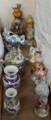 A collection of Beswick Beatrix Potter figures together with a blue and white pottery cow creamer,