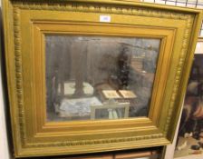 A shaped gilt wall mirror together with another gilt wall mirror