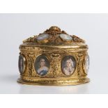 A BOX WITH MINIATURES Around 1840; France 11,5x15x13 cm Gilt brass, gouache painting on ivory,