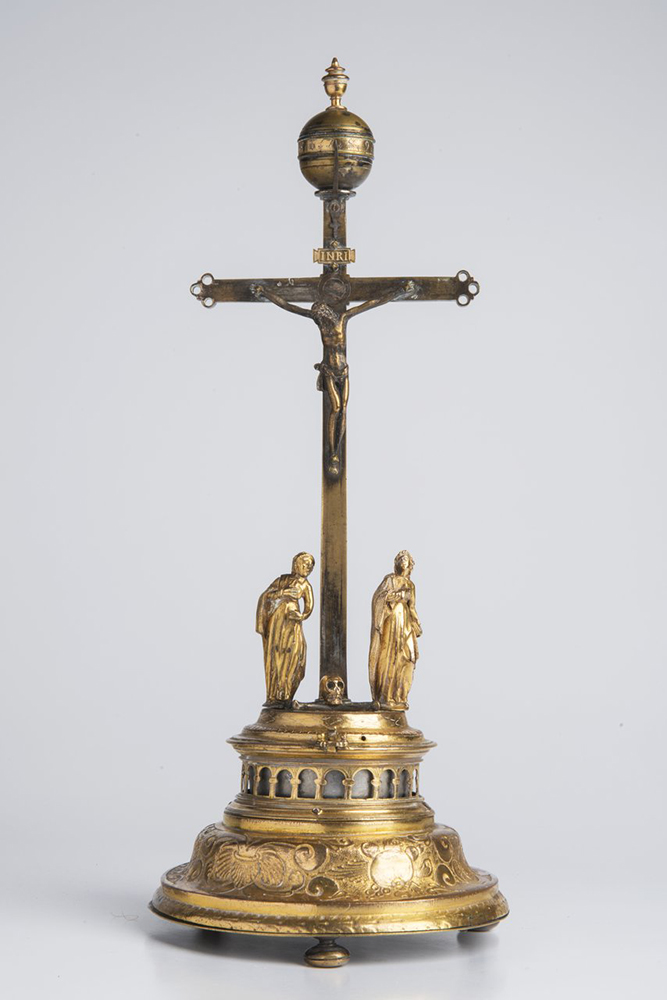 A CRUCIFIXION CLOCK 17th-18th century; Germany 39 cm Gold- and silver-plated brass. Rising from