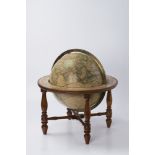 A TABLETOP TERRESTRIAL GLOBE 1860; United States 45x43 cm, Diameter: 30 cm Lined paper glued to a