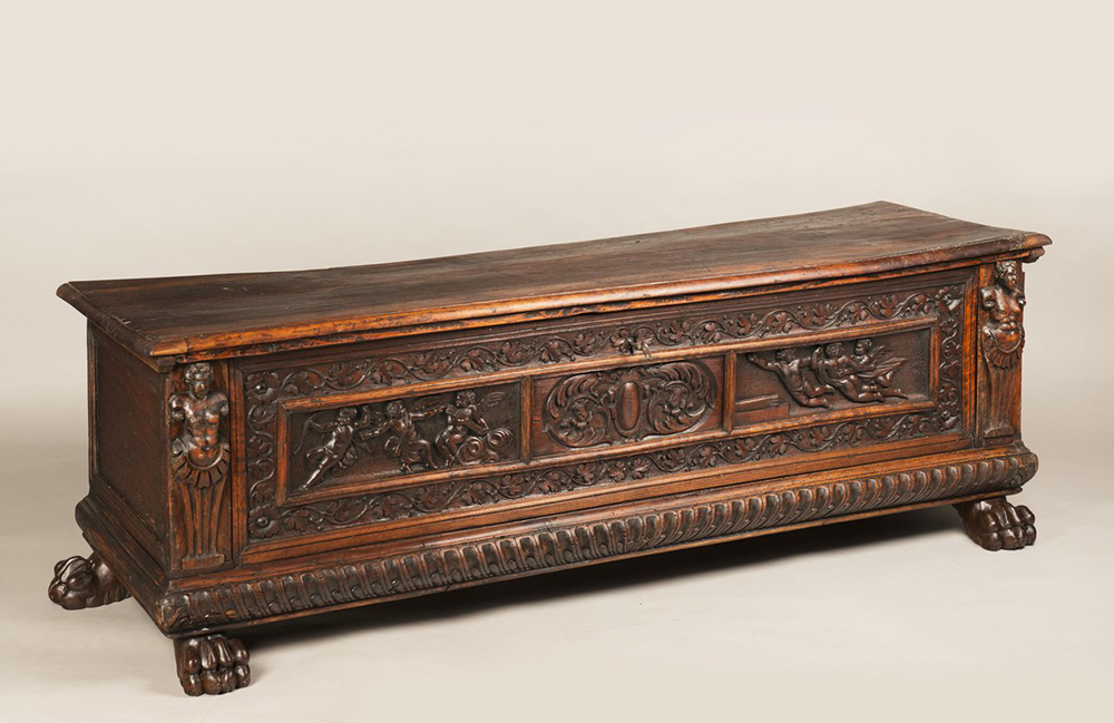 A MANNERIST CHEST Early 17th century; Northern Italy 57x168x52 cm Walnut. A richly carved