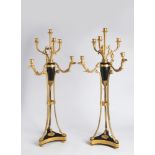 A PAIR OF EMPIRE STYLE CANDLE HOLDERS 19th century; France 91 cm Gilt bronze, areas of black patina.