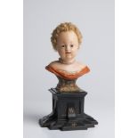 BUST OF A GIRL First half of 18th century 23 cm Wax, hair, wood, glass, pearls, metal. This Late