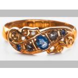 AN 18CT YELLOW GOLD, DIAMOND AND SAPPHIRE RING, claw set with scroll decoration, 2.4g.