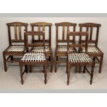 A SET OF FOUR HARDWOOD DINING CHAIRS, the arched top-rail above twin splats and riempie seats,